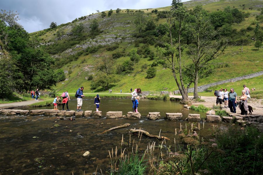 Dovedale stepping stones family crossing. Dovedale stepping stones family crossing.