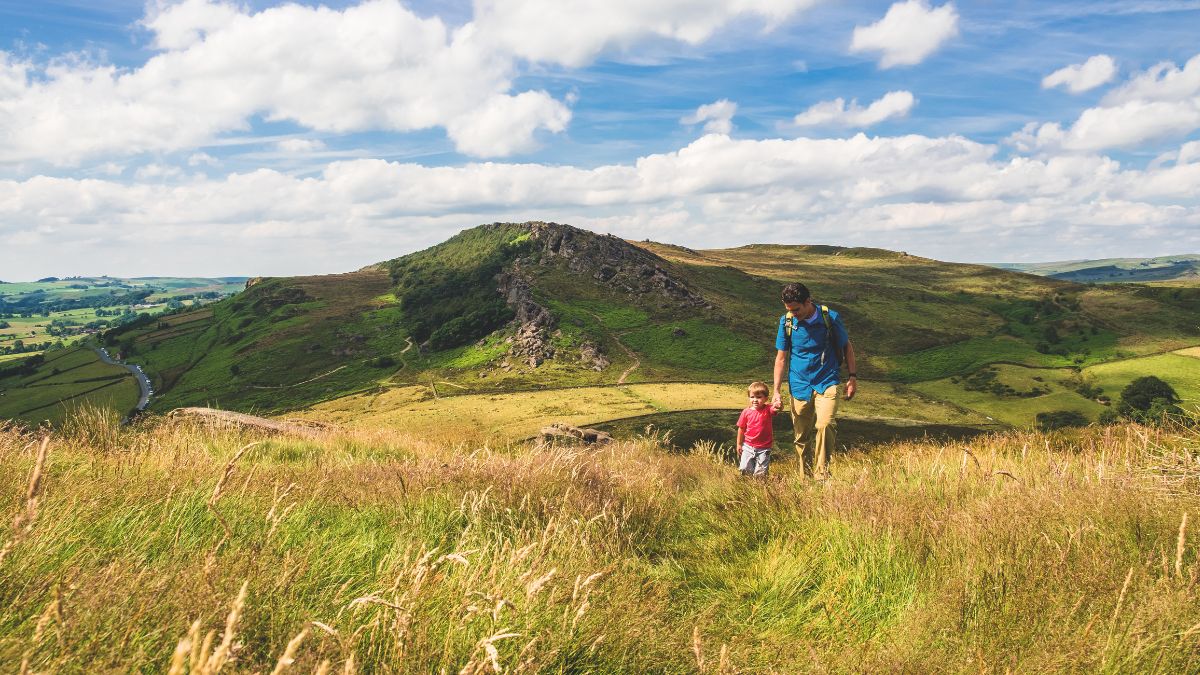Father and son hiking Peak District.