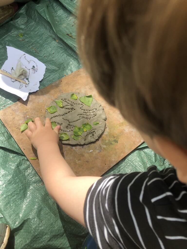 Clay modelling with natural materials.